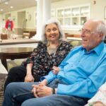A couple sits on a couch at Paul's Run Retirement Community in northeast Philadelphia.