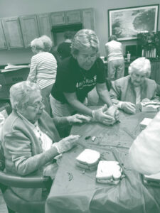 At Paul's Run Retirement Community, the community service club makes sandwiches for the homeless.