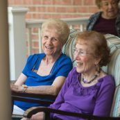 women on pauls run sitting on a porch