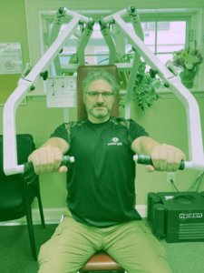 Matt, Fitness Director, demonstrates a strength-training exercise.
