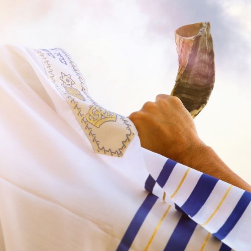 Jewish man blows the Shofar of Rosh Hashanah