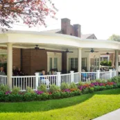 Residents socialize on the front porch at Paul's Run retirement community.