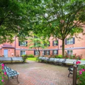 The courtyard at Paul's Run retirement community in spring with abundant flowers